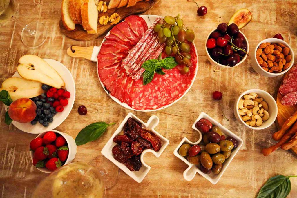An image of different kinds of food on the table.