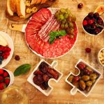An image of different kinds of food on the table.