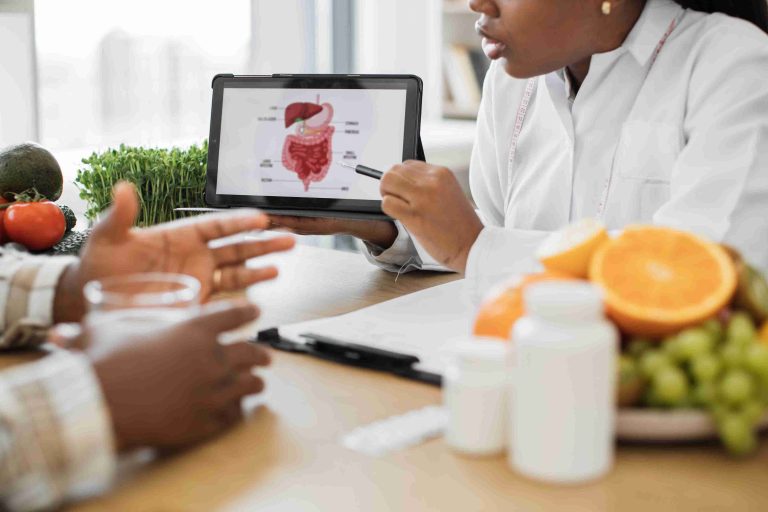 Healthcare worker explaining the digestive system to a patient.