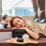 Woman receiving massage and relaxing.